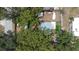 Aerial view of backyard featuring a shed, boat and artificial turf, showcasing property layout at 5304 Cherry Ave, Seffner, FL 33584