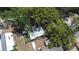 Overhead view of a backyard featuring a well-maintained lawn and multiple sheds at 5304 Cherry Ave, Seffner, FL 33584