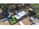 Aerial view of a backyard featuring multiple sheds and a well-maintained lawn at 5304 Cherry Ave, Seffner, FL 33584