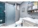 Modern bathroom with glass shower door, new toilet, sink and medicine cabinet at 5304 Cherry Ave, Seffner, FL 33584