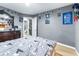 Comfortable bedroom with gray walls featuring walk-in closet and en-suite bathroom at 5304 Cherry Ave, Seffner, FL 33584