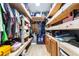Walk-in closet with wood shelves and storage for optimal organization at 5304 Cherry Ave, Seffner, FL 33584