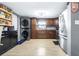 Functional kitchen featuring stainless steel appliances, wood cabinets, laundry and modern finishes at 5304 Cherry Ave, Seffner, FL 33584