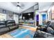 Bright living area with hardwood floors, leather furniture and a modern design at 5304 Cherry Ave, Seffner, FL 33584