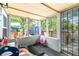 Enclosed patio with black deck offers a relaxing space with views of the outdoors at 5304 Cherry Ave, Seffner, FL 33584