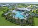 Aerial view showing the pool, clubhouse, and landscaping in this Primary-planned community at 5727 Silverside Pine Ct, Lakewood Ranch, FL 34211