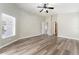 A spacious bedroom with light-colored walls and views from the window at 6218 Bridgevista Dr, Lithia, FL 33547