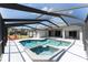 Screened-in pool and spa with an outdoor patio, seating, and a beautiful view of the property at 6218 Bridgevista Dr, Lithia, FL 33547