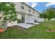 This well-maintained backyard includes a patio and privacy fence at 6306 Tillandsia Pl, Tampa, FL 33610