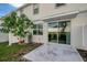 Backyard featuring a sliding glass door, patio, and green space at 6306 Tillandsia Pl, Tampa, FL 33610