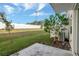 Spacious backyard featuring a well-maintained lawn and a privacy fence at 6306 Tillandsia Pl, Tampa, FL 33610