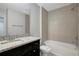 Bathroom with granite countertop, modern cabinets, shower and tub combination at 6306 Tillandsia Pl, Tampa, FL 33610