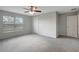 Bedroom with window, ceiling fan, and neutral carpet at 6306 Tillandsia Pl, Tampa, FL 33610