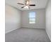 Bedroom featuring a ceiling fan, and a window letting in natural light at 6306 Tillandsia Pl, Tampa, FL 33610