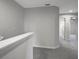 Upstairs hallway with carpet and doors at 6306 Tillandsia Pl, Tampa, FL 33610