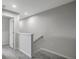 Upstairs hallway with carpet and doors at 6306 Tillandsia Pl, Tampa, FL 33610