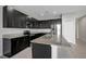 Modern kitchen features granite countertops, stainless steel appliances, and dark wood cabinets at 6306 Tillandsia Pl, Tampa, FL 33610