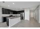 An open kitchen featuring granite countertops and stainless steel appliances at 6306 Tillandsia Pl, Tampa, FL 33610