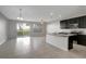 Modern open-concept kitchen with an island and stainless steel appliances at 6306 Tillandsia Pl, Tampa, FL 33610