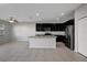 A well-lit kitchen with stainless steel appliances and a kitchen island at 6306 Tillandsia Pl, Tampa, FL 33610
