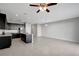 Open concept living space features tile flooring and seamlessly connects the kitchen to the living area at 6306 Tillandsia Pl, Tampa, FL 33610