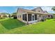 Exterior of the property showing the back of the house with a well-maintained green lawn at 6514 Thicket Trl, New Port Richey, FL 34653