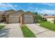 Well-maintained townhome with attached garages and well-kept lawns at 6514 Thicket Trl, New Port Richey, FL 34653