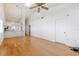 Open-concept living room with vaulted ceilings and wood flooring at 6514 Thicket Trl, New Port Richey, FL 34653