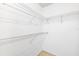 A walk-in closet features wire shelving for storing clothing, shoes, and accessories at 6514 Thicket Trl, New Port Richey, FL 34653