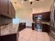 Charming kitchen featuring stainless steel appliances, granite counters, and tile backsplash at 6534 Fairway Gardens Dr # 17-201, Bradenton, FL 34203