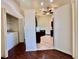 A peek into the kitchen from the living room, showcasing dark wood cabinets and stainless steel appliances at 6534 Fairway Gardens Dr # 17-201, Bradenton, FL 34203