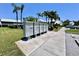 Community mailboxes with manicured lawns, landscaping, and a parking area at 6534 Fairway Gardens Dr # 17-201, Bradenton, FL 34203