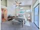 Beautifully furnished bedroom featuring a bed, lamps, bench and sliders to balcony at 6534 Fairway Gardens Dr # 17-201, Bradenton, FL 34203