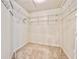 Spacious walk-in closet with wire shelving and neutral carpet offers ample storage solutions at 6534 Fairway Gardens Dr # 17-201, Bradenton, FL 34203