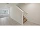 Staircase and view to front door and backyard sliding glass door at 7530 Broad Pointe Dr, Zephyrhills, FL 33540