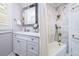 Elegant bathroom featuring a marble countertop and framed mirror plus separate shower at 827 S Delaware Ave, Tampa, FL 33606