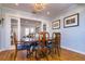 Well-lit dining room featuring a chandelier, hardwood floors, and views of other rooms at 827 S Delaware Ave, Tampa, FL 33606