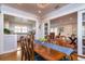 Elegant dining room with hardwood floors, chandelier lighting, and an open layout to the kitchen at 827 S Delaware Ave, Tampa, FL 33606