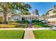 Charming single-story home with a well-manicured front yard and inviting curb appeal at 827 S Delaware Ave, Tampa, FL 33606
