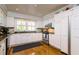 Spacious kitchen with white cabinets, granite countertops, and stainless steel appliances at 827 S Delaware Ave, Tampa, FL 33606