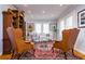 Cozy living room with comfortable seating, hardwood floors, and bright windows at 827 S Delaware Ave, Tampa, FL 33606