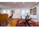 Elegant living room featuring hardwood floors, natural light, and custom built-in shelving at 827 S Delaware Ave, Tampa, FL 33606