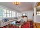 Cozy living room with natural light, stylish furniture, hardwood flooring and bright decor at 827 S Delaware Ave, Tampa, FL 33606