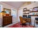 Cozy office with hardwood floors, custom shelving, and a stylish oriental rug at 827 S Delaware Ave, Tampa, FL 33606