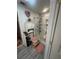 Cozy bathroom featuring a tiled walk-in shower and pink accessories at 8361 Cofield Ln, Spring Hill, FL 34608