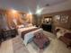 Well decorated bedroom with a large bed and unique decor on the walls at 8361 Cofield Ln, Spring Hill, FL 34608