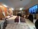 Spacious bedroom showcasing wood wall art, comfy seating, and a ceiling fan at 8361 Cofield Ln, Spring Hill, FL 34608