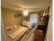 Comfortable bedroom featuring twin beds, neutral decor, and a cozy atmosphere for a restful night's sleep at 8361 Cofield Ln, Spring Hill, FL 34608