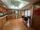 The kitchen features stainless steel appliances and a dining area, perfect for casual meals at 8361 Cofield Ln, Spring Hill, FL 34608