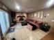 Cozy living room featuring a brick fireplace and decorative accents at 8361 Cofield Ln, Spring Hill, FL 34608